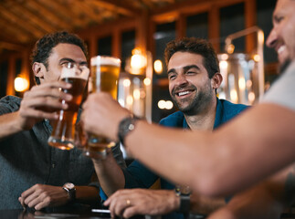 Glasses, friends and beer in pub with drinks as celebration for cheers, happiness or social...