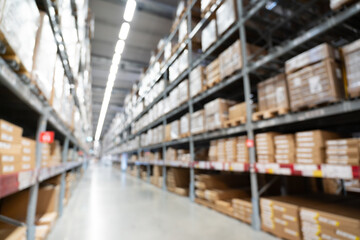 Abstract Blurred Storage Warehouse Logistics. Blurred industrial warehouse with goods and products. Logistics, business, delivery, services concept. Defocused industrial storehouse interior.