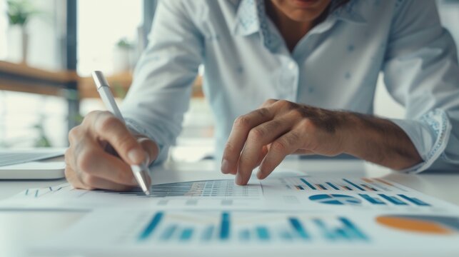 Confident Business Professional Reviewing Market Trends in Sleek Modern Office Setting - Powered by Adobe