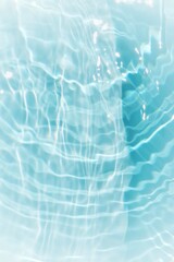 Blue water with ripples on the surface. Defocus blurred transparent blue colored clear calm water surface texture with splashes and bubbles. Water waves with shining pattern texture background.	