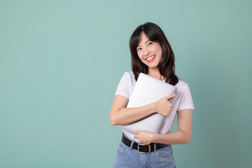 Technology lover concept. Cheerful asian woman hugging laptop. Casual female geek hug a computer...