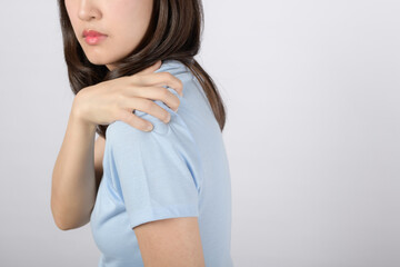 Shoulder muscle pain injury. Woman hold her pained arm shoulder muscle isolated on white background. Healthcare or office syndrome problem concept.