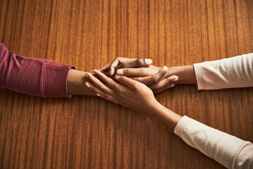 Couple, holding hands and above for care in home with support, connection and empathy for mental...