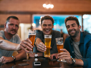 Portrait, men and beer in pub with glasses as celebration for drinks, happiness or social bonding. Friends, cheers and people in restaurant for birthday party, event and reunion in Germany with toast