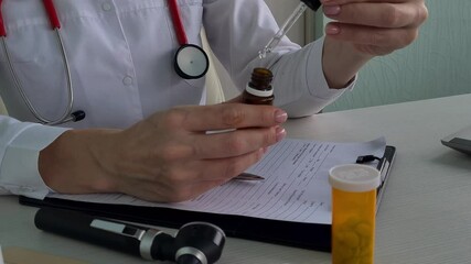 Doctor Filling Dropper Bottle in Medical Office