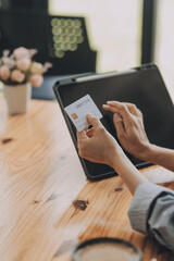 Happy asian woman using smartphone shopping online with credit card. Lifestyle. Easy pay using smart phone or digital device.
