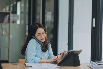 Asian woman working at the office. woman using laptop computer on desk at office