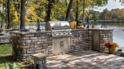 Outdoor stone barbecue kitchen by a lake in autumn. Concept of outdoor cooking, leisure, and fall gatherings.