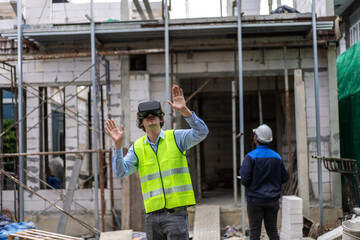 Fototapeta premium Professional of team architect industrial engineer in helmet working new construction project architectural plan with blueprint and construction tool on table at the building construction site