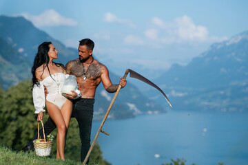 Family eco lifestyle. Eco people agriculture and green business. Sexy farm couple in Switzerland,...