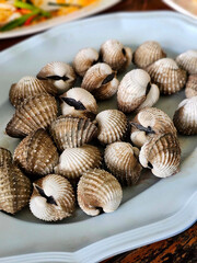 Boiled cockles served on plates