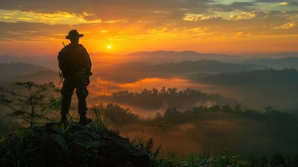Fototapeta premium Silhouette of an environmental resource management officer working diligently, overlooking a forest reserve from a high vantage point. The officer is surrounded by nature, symbolizing their