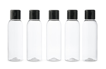 Five Clear Plastic Bottles With Black Caps on a White Background
