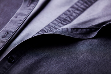 Close up of dark Men's shirt. Soft focus. Copy space.	