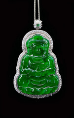 Imperial green Myanmar Jadeite Jade Guan Yin (Avalokitesvara) pendant isolated on black background