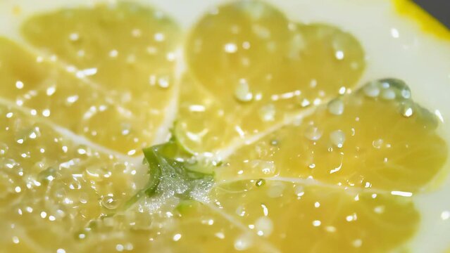 Vibrant yellow lemon slice with glistening water droplets. Intricate pulp details, bright citrus hues. Fresh, tangy, and appetizing close-up showcasing nature's perfection.	