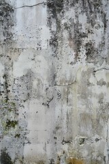 Fototapeta premium Weathered concrete wall with signs of erosion, faint graffiti marks, and patches of moss in damp areas, Generative AI 
