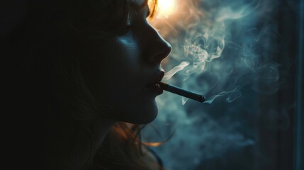 Obraz premium Smoking cigarette against dark backdrop