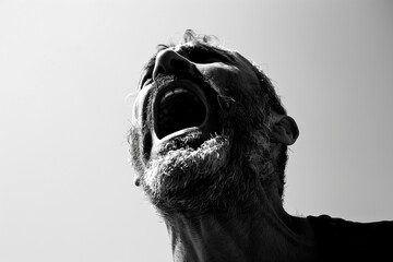 A man yelling angry on a white background