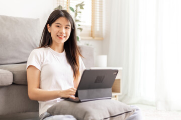 Woman meeting online on her laptop and smartphone at home