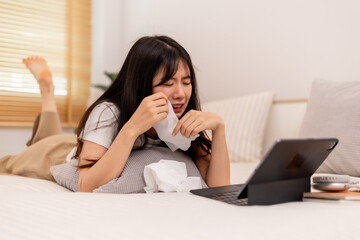 Woman watches series and cries in her bed