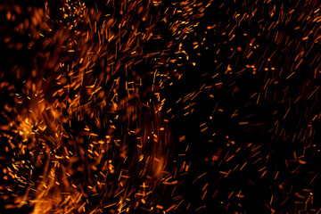 fire flame with sparks on black background.