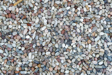 Stone pebbles texture or stone pebbles background. stone gravel for interior exterior decoration and industrial construction concept design. a naturally occurring stone pebble motif.
