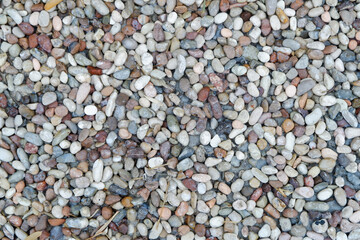 Stone pebbles texture or stone pebbles background. stone gravel for interior exterior decoration and industrial construction concept design. a naturally occurring stone pebble motif.