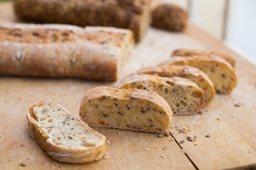 Fresh loaf of bread on wooden board