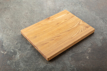 Cutting board on a kitchen table.