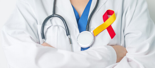 World hepatitis day awareness month, 28 July. Doctor holding Red and Yellow ribbon. Liver cancer,...