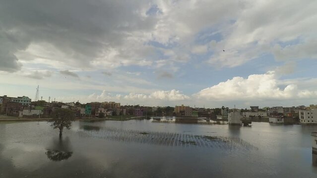 Timelapse City in monsoon with reflection in lake, Patna, Bihar, India