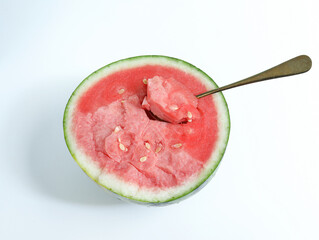 Watermelon, a fresh summer fruit, is cut open on a white table
