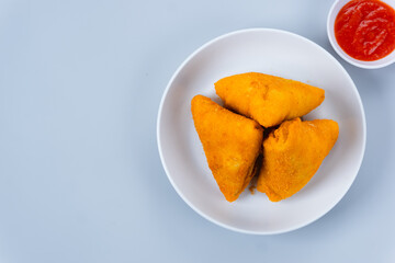 Risol or rissoles. served with chili sauce or chili. perfect for recipe, article, catalogue, promotion, or any cooking contents. with copy space.