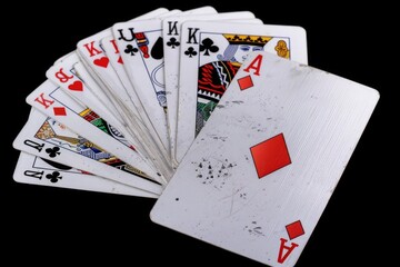 A pile of playing cards stacked on top of each other, perfect for use in designs related to gaming or leisure activities