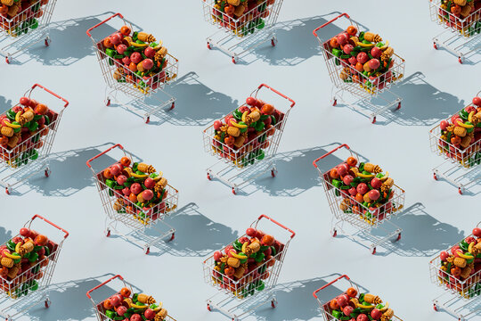 Repetition of shopping cart filled with colorful fruits and vegetables over blue background