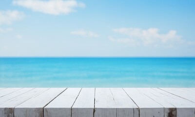 Obraz premium White wooden table with blue sea and sky background