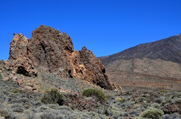 Scenic view of volcanic rock formations in desert during sunny day, Teide National Park, Tenerife