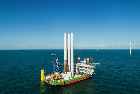 Drone view of wind turbine installation vessel at offshore wind farm in North Sea