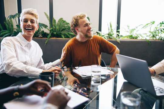 Happy business colleagues engaging in a successful meeting