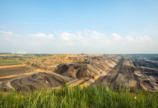Open pit coal mine under sky