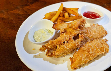 Fish and chips with french fries, tartar sauce