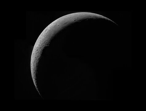Thin crescent moon with many details of lunar surface