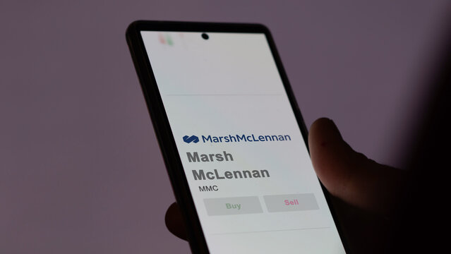 April 09th 2024 , New York City, New York. Close up on logo of Marsh McLennan on the screen of an exchange. Marsh McLennan price stocks, $MMC on a device.