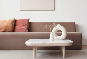 View of modern scandinavian style interior with sofa and trendy vase, Home staging and minimalism...