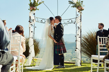 Wedding, ceremony and people outside for kiss, love and marriage promise in Scotland for vows...