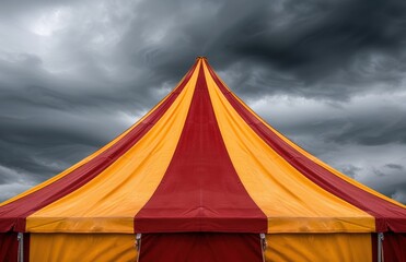 Vibrant circus tent against stormy sky