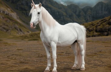 Obraz premium majestic white unicorn standing in a mountain landscape