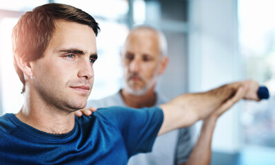 Physiotherapy, man and arm with stretching in clinic for rehabilitation, treatment and support. Orthopedic, service and people with exercise in office for injury, assessment or consulting on progress