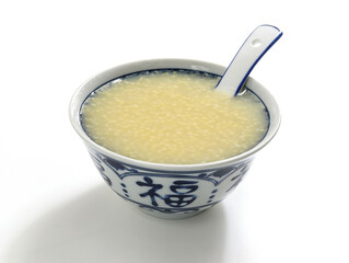 A bowl of nutritious breakfast millet porridge on the white table